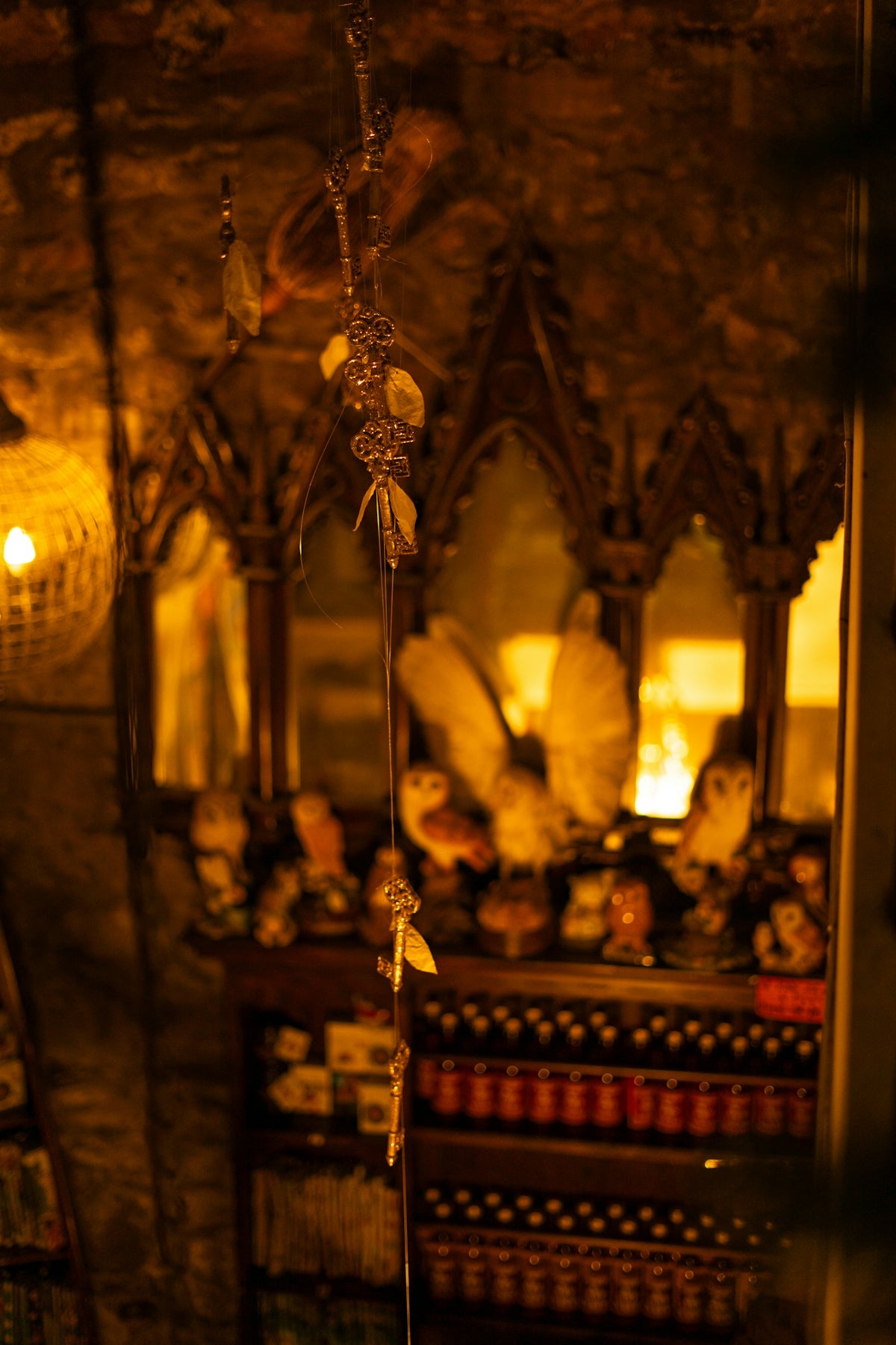 Ornate shelf display with owls and decorative items